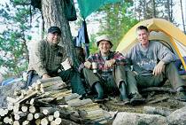 Ken, Randy and Robert, by Ken's mighty woodpile.